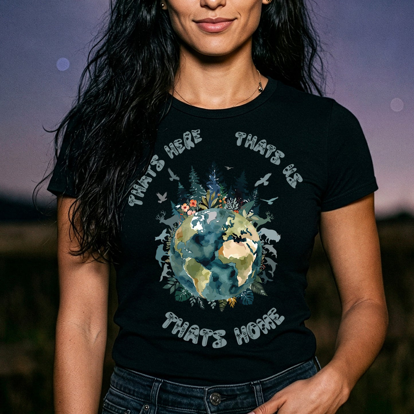 Nature planet Earth graphic black t-shirt on woman with wildlife illustration and “That’s Home” eco design