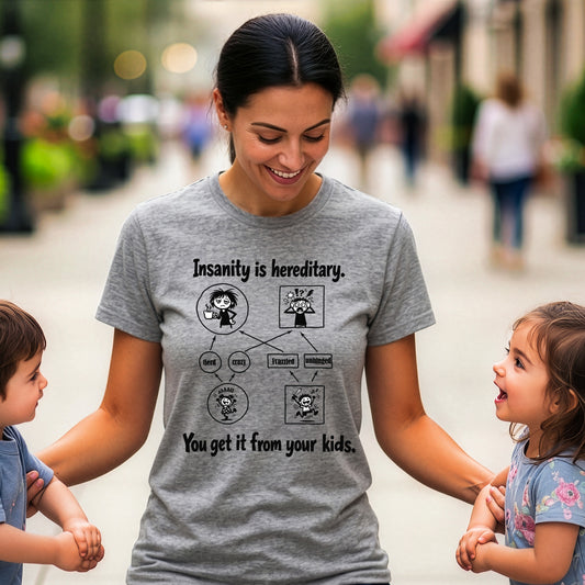Mom wearing a women's grey T-shirt that says "Insanity is hereditary" while holding her kids.