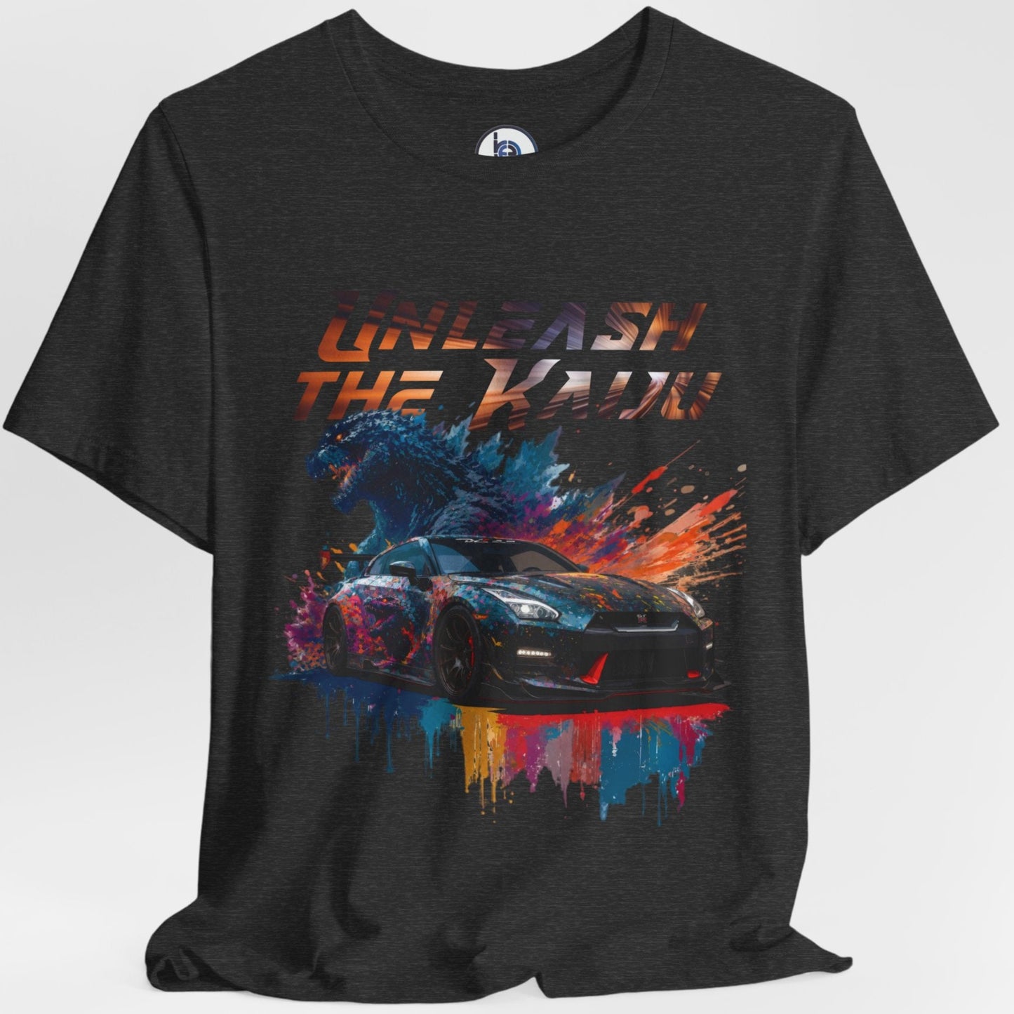 black-layflat t-shirt with a graphic design of a nissan gtr35 godzilla design and text 'Unleash the Kaiju' on a white background