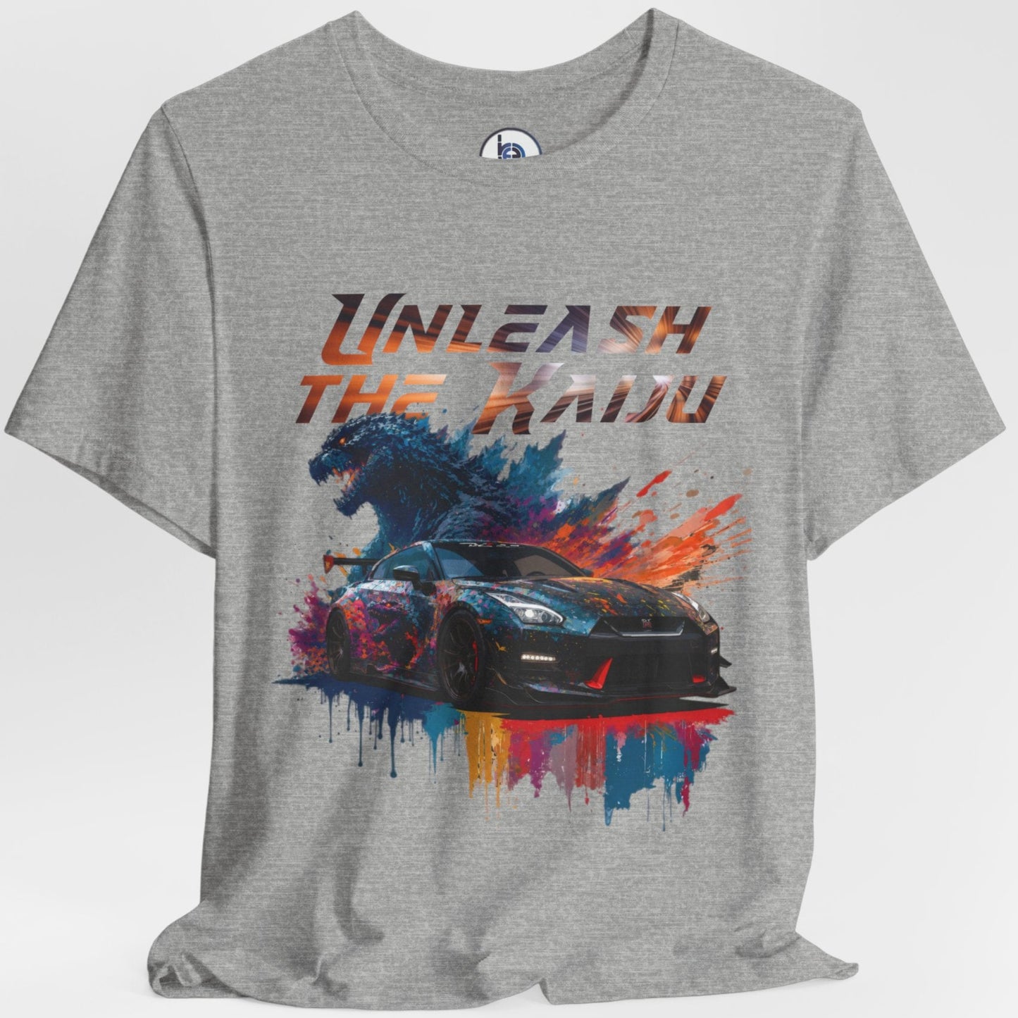 Gray layflat t-shirt with a graphic design of a nissan gtr35 godzilla design and text 'Unleash the Kaiju' on a white background