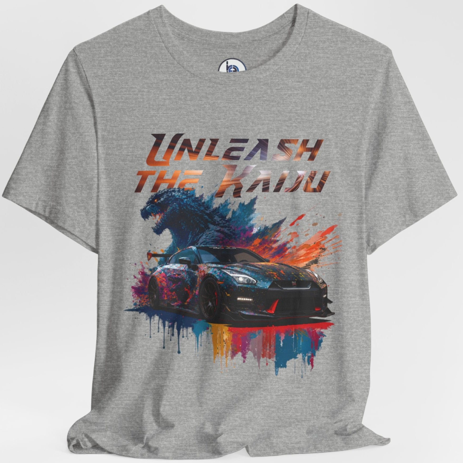 Gray layflat t-shirt with a graphic design of a nissan gtr35 godzilla design and text 'Unleash the Kaiju' on a white background
