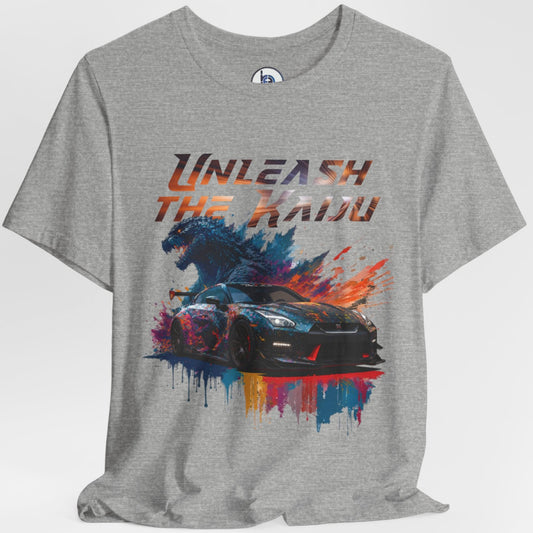 Gray layflat t-shirt with a graphic design of a nissan gtr35 godzilla design and text 'Unleash the Kaiju' on a white background