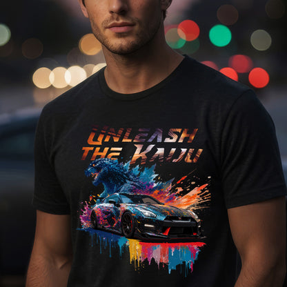 Man wearing a black t-shirt with nissan gtr35 with godzilla design and text 'UNLEASH THE KADO' against a blurred lights background