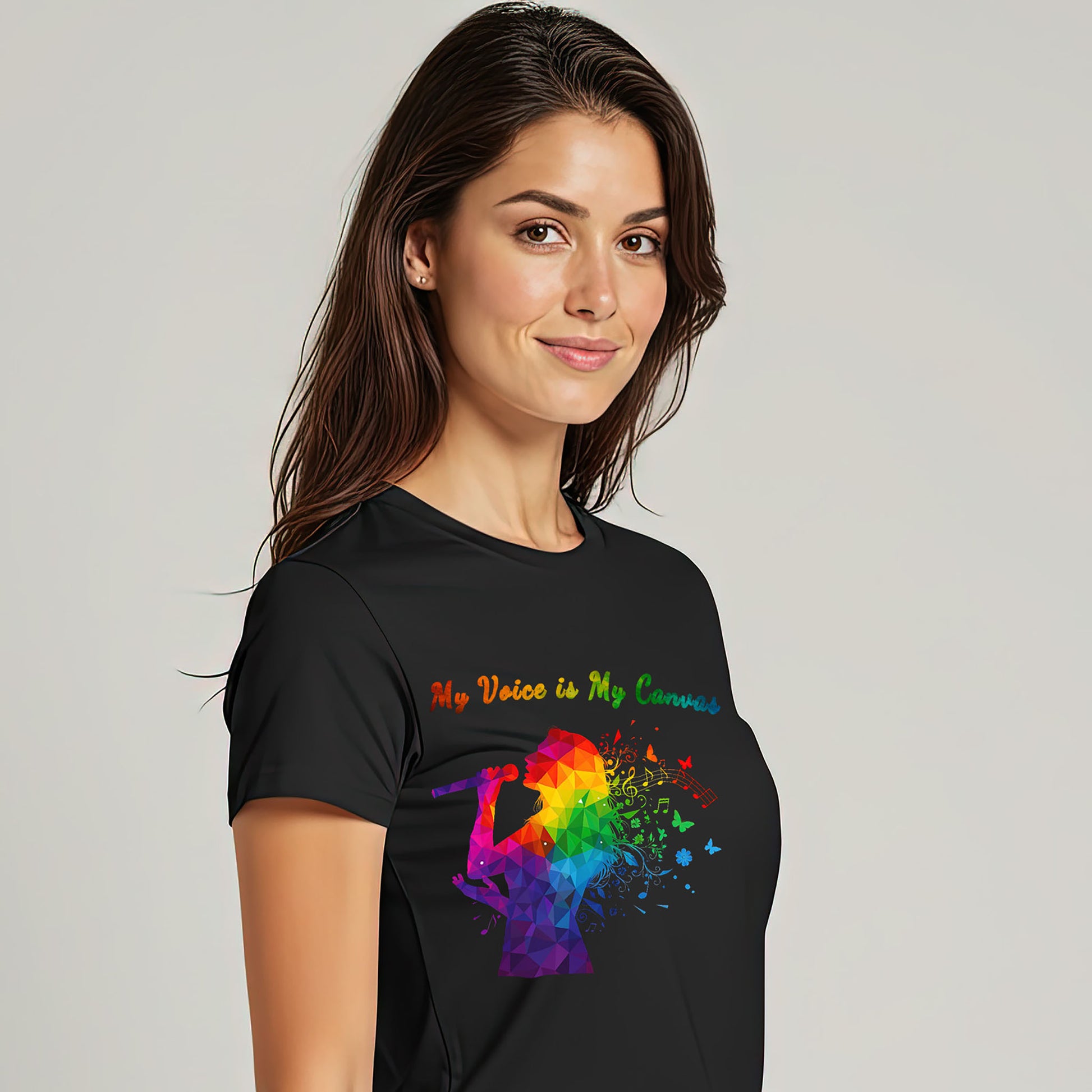 Right side view of woman wearing My Voice Is My Canvas music graphic t-shirt in black